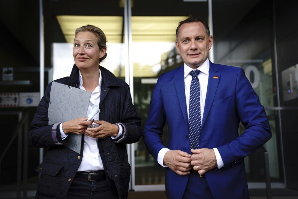 FILE - Tino Chrupalla, right, co-leader of the 'Alternative For Germany' (AfD) party, and Alice Weidel, left, the party's second co-leader, are pictured after a news conference in Berlin Tuesday, May 25, 2021 .The prosecution office of the city of Ingolstadt has launched an investigation against “unknown persons” who allegedly assaulted Tino Chrupalla, one of the leaders of the German far-right Alternative for Germany party. (Kay Nietfeld/dpa via AP, File)