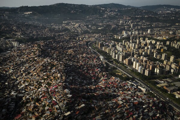 Homes cover a hill in the Petare neighborhood of Caracas, Venezuela, Monday, Oct. 2, 2023. (AP Photo/Matias Delacroix)