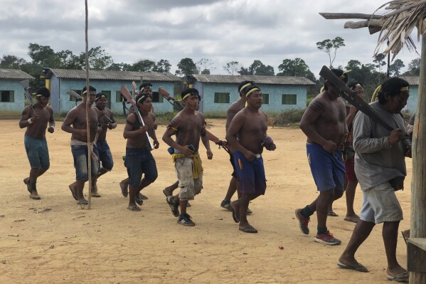 Indigenous Xikrin warriors return from a failed attempt to expel land squatters from the Trincheira Bacaja Indigenous Indigenous territory, in Brazilian Amazon, Para state, Brazil, Aug. 24, 2019. Brazil's government on Monday, Oct. 2, 2023, began removing non-indigenous people from two Indigenous territories in a move that will affect thousands living in the Amazon rainforest's heart. (AP Photo/Fabiano Maisonnave)