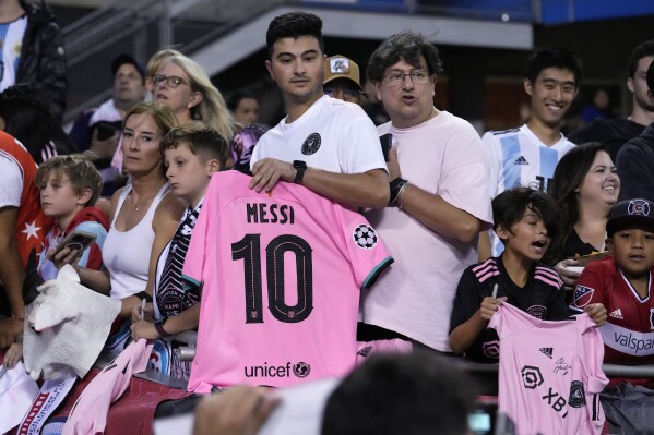 Fans wait, hoping to get an autograph from Inter Miami forward Lionel Messi before the team's MLS soccer match against the Chicago Fire in Chicago, Wednesday, Oct. 4, 2023. Messi was not in Chicago for the match. (AP Photo/Nam Y. Huh)