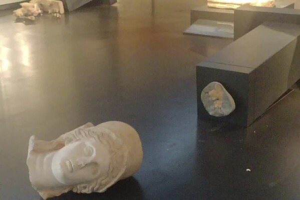 This image released by Israel Police shows two ancient Roman statues toppled at the Israel Museum in Jerusalem, Thursday, Oct. 5, 2023. Israeli police have arrested an American tourist at the museum after he hurled works of art to the floor, defacing two second-century Roman statues. The vandalism late Thursday raised questions about the safety of Israel's priceless collections and stirred concern about a rise in attacks on cultural heritage in Jerusalem. (Israel Police via AP)