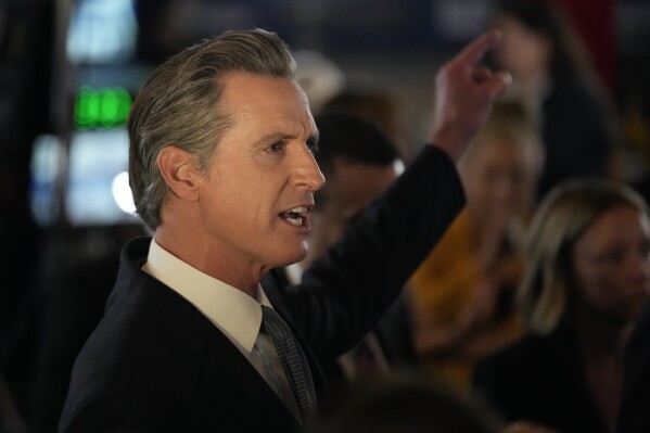California Gov. Gavin Newsom fields questions in the spin room before a Republican presidential primary debate hosted by FOX Business Network and Univision, Wednesday, Sept. 27, 2023, at the Ronald Reagan Presidential Library in Simi Valley, Calif. (AP Photo/Marcio Jose Sanchez)