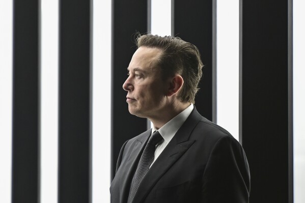 FILE - Tesla CEO Elon Musk attends the opening of the Tesla factory Berlin Brandenburg in Gruenheide, Germany, March 22, 2022. Germany's government rebuked X owner Elon Musk after he criticized the recent work of migrant rescue ships that German humanitarian groups operate in the Mediterranean Sea. (Patrick Pleul/Pool via AP, File)