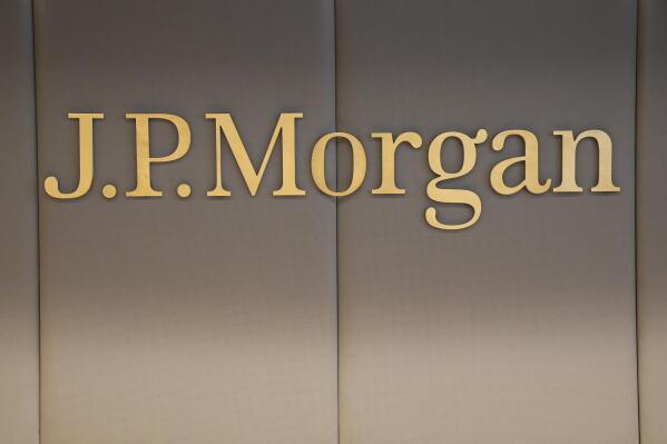 FILE - The logo of JP Morgan bank is pictured at the new French headquarters of JP Morgan bank, Tuesday, June 29, 2021, in Paris. After the U.S. Supreme Court revoked the federal right to an abortion that's been in place for half a century, companies like Amazon, Disney, Apple and JP Morgan pledged to cover travel costs for employees who live in states where the procedure is now illegal so they can terminate pregnancies. (AP Photo/Michel Euler, Pool, File)