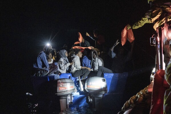 FILE - Rescuers approach a migrants' boat adrift in international waters off Malta in the Mediterranean Sea, on Oct. 25, 2022. The leaders of nine southern European Union countries met in Malta on Friday, Sept. 29, 2023, to discuss common challenges such as migration, the EU's management of which has vexed national governments in Europe for years. (AP Photo/Vincenzo Circosta)