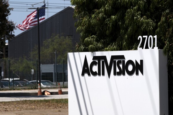 FILE - A sign outside the Activision building in Santa Monica, Calif., June 21, 2023. British competition regulators signaled Friday, Sept. 22 that Microsoft’s restructured $69 billion deal to buy video game maker Activision Blizzard is likely to receive antitrust approval by next month's deadline. (AP Photo/Richard Vogel, File)