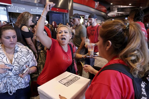 Culinary Union members, including Veronica Flores Serrano, who works at The Linq, cast their ballots during a strike vote, Tuesday, Sept. 26, 2023, at Thomas & Mack Center on the UNLV campus in Las Vegas. Tens of thousands of hospitality workers who keep the iconic casinos and hotels of Las Vegas humming were set to vote Tuesday on whether to authorize a strike amid ongoing contract negotiations. (K.M. Cannon/Las Vegas Review-Journal via AP)